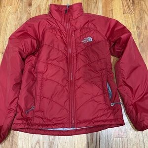 Woman's red north face puffy jacket